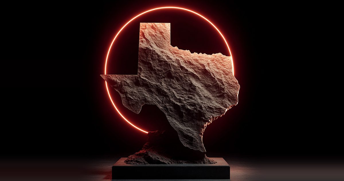 Texas carved in stone, framed by a red neon ring